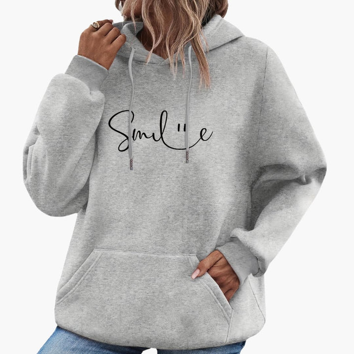 Caroline - Snygg Smile Graphic Hoodie för kvinnor