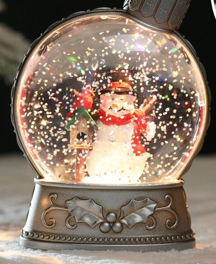 Upplyst glitterkula med snögubbe