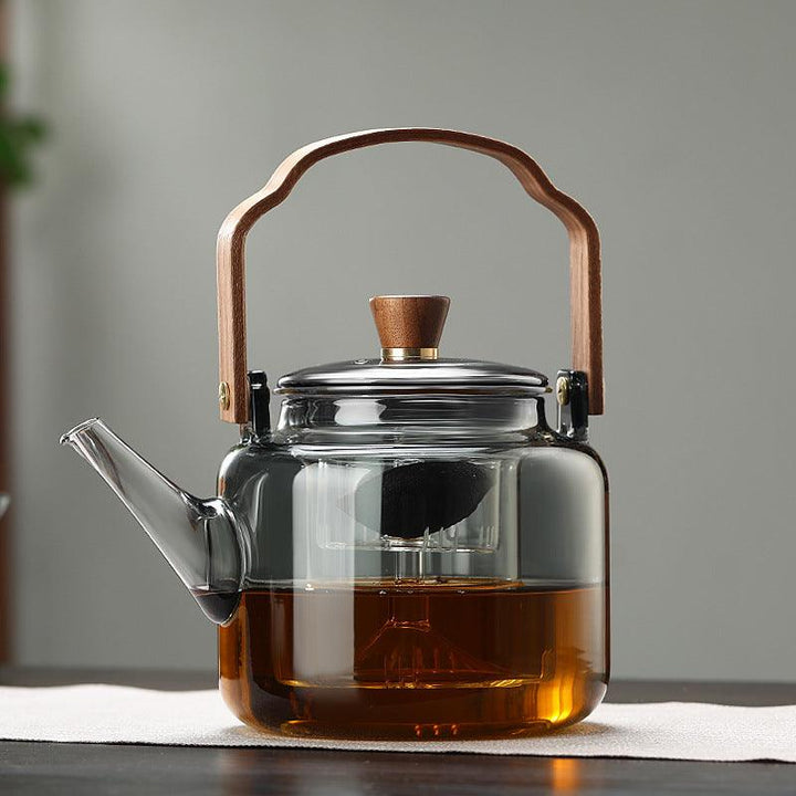 Teekanne i Glas med Trehåndtak – Elegant Design för Tedrikking