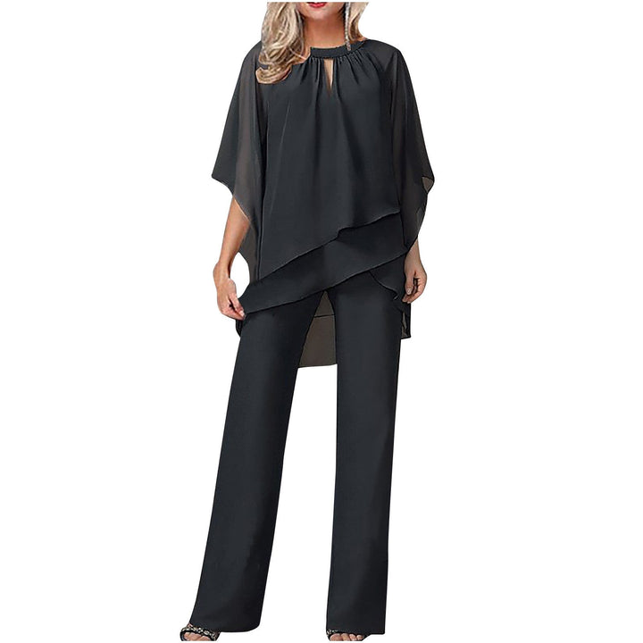 Elegant Kvinna Ensemble med Asymmetrisk Topp &amp; Bred Byxa
