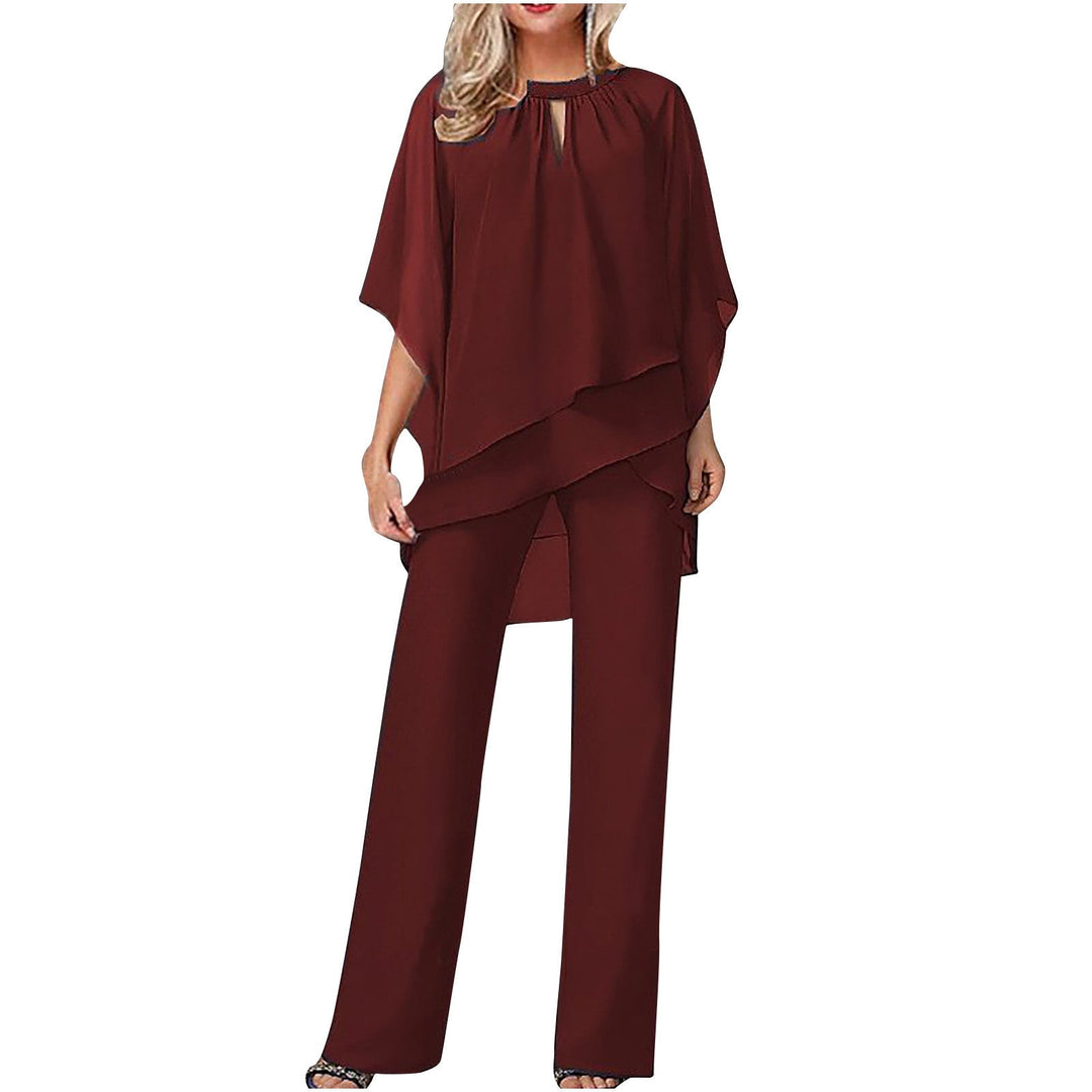 Elegant Kvinna Ensemble med Asymmetrisk Topp &amp; Bred Byxa
